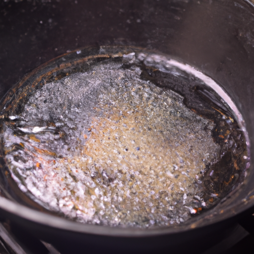 A cast iron pan being seasoned with oil